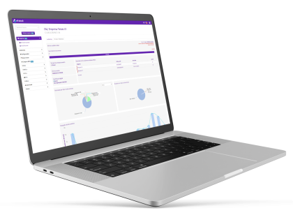 Computador portátil exibindo o dashboard do software Immobile da Alterdata, com gráficos de pizza e várias opções de menu para gestão de condomínios.